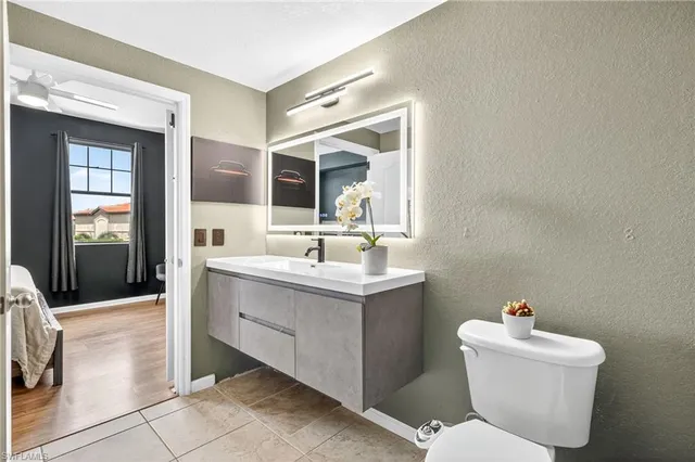 a kitchen with stainless steel appliances granite countertop a refrigerator and a stove