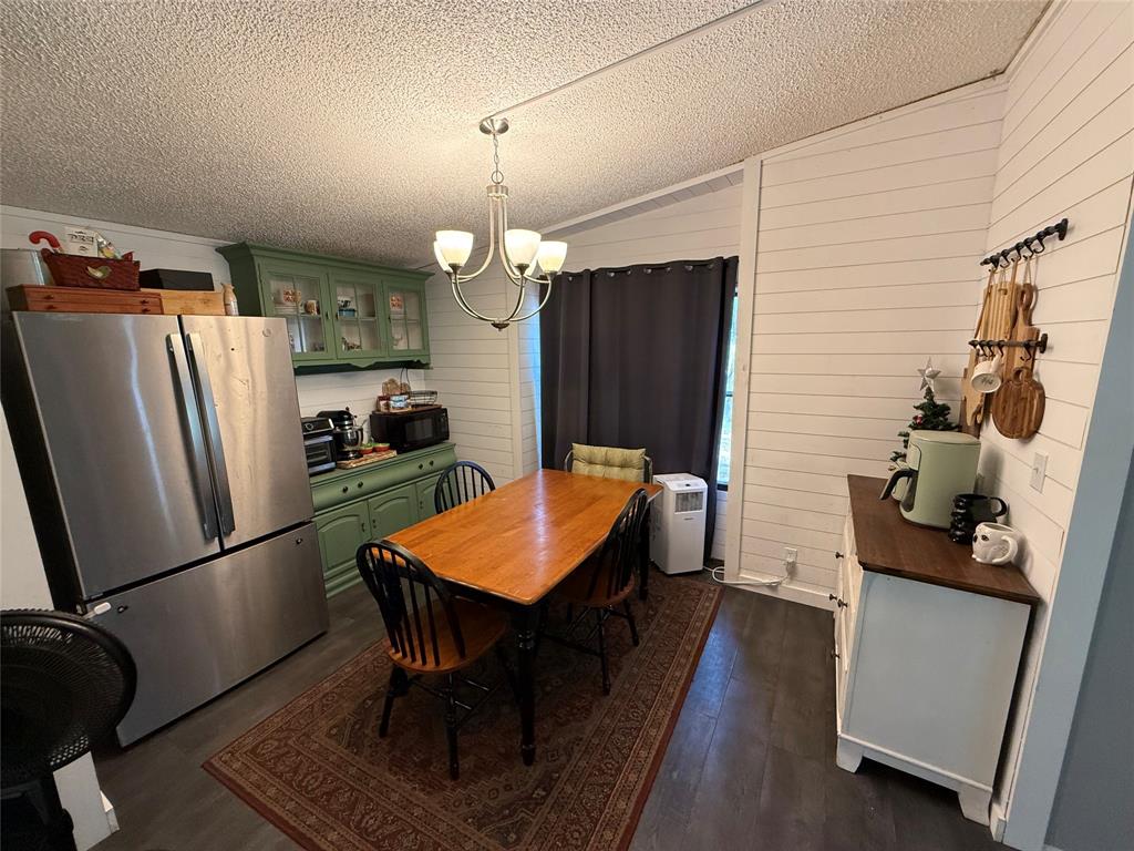 148 Indian Gap Road Mabank, TX 75156 - Photo 4 of 23 a kitchen with stainless steel appliances kitchen island a refrigerator and a dining table