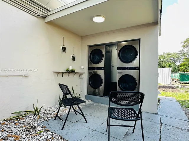 a living room with furniture and a clock