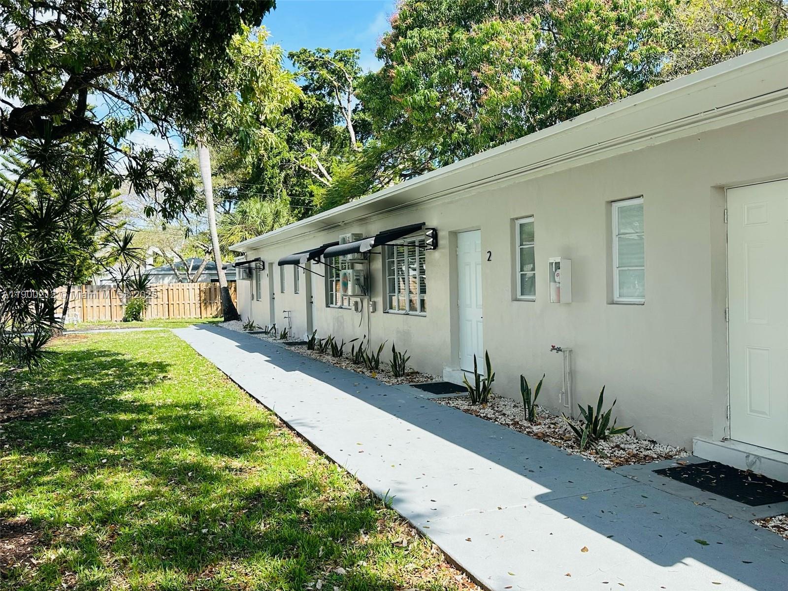 407 Southeast 14th Court, Unit 2 Fort Lauderdale, FL 33316 - Photo 16 of 16 a front view of a house with garden