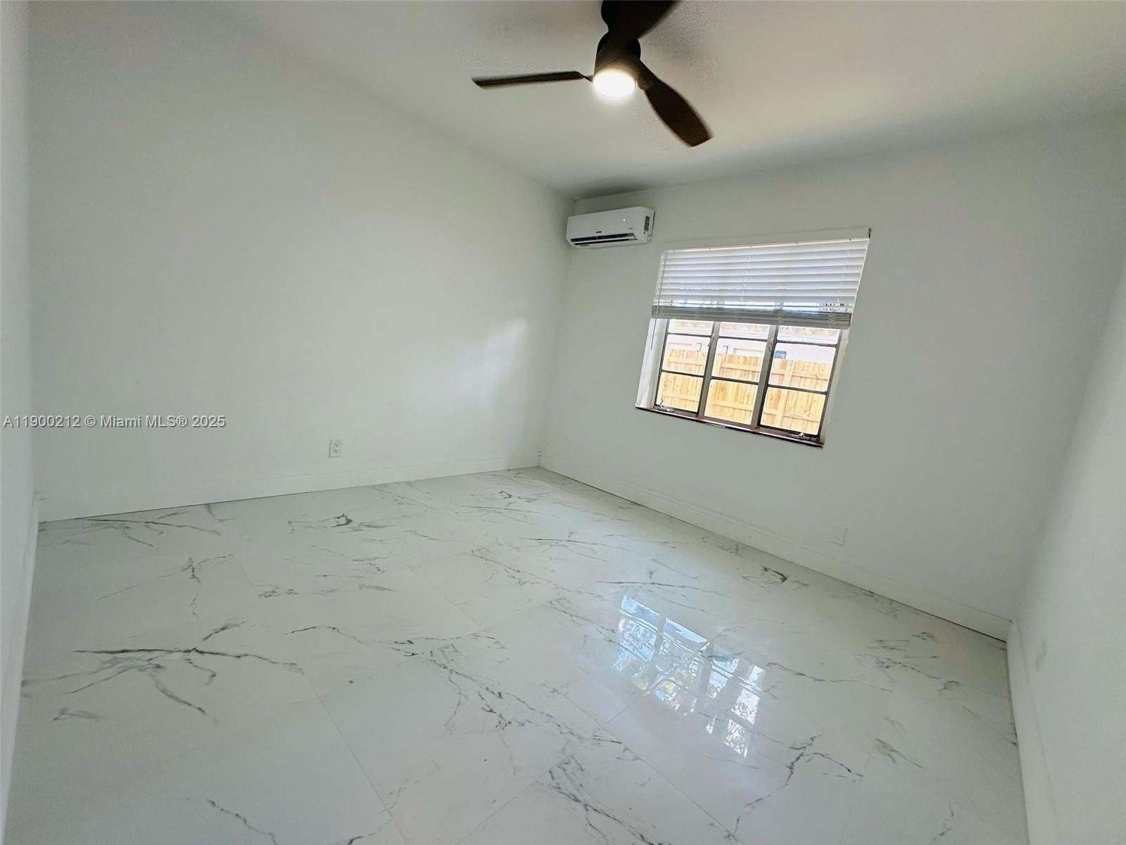 407 Southeast 14th Court, Unit 2 Fort Lauderdale, FL 33316 - Photo 9 of 16 an empty room with a window