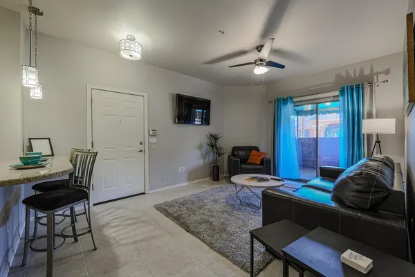 a living room with furniture and a flat screen tv