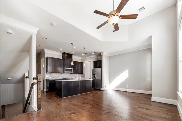 a view of a kitchen with a sink and a window