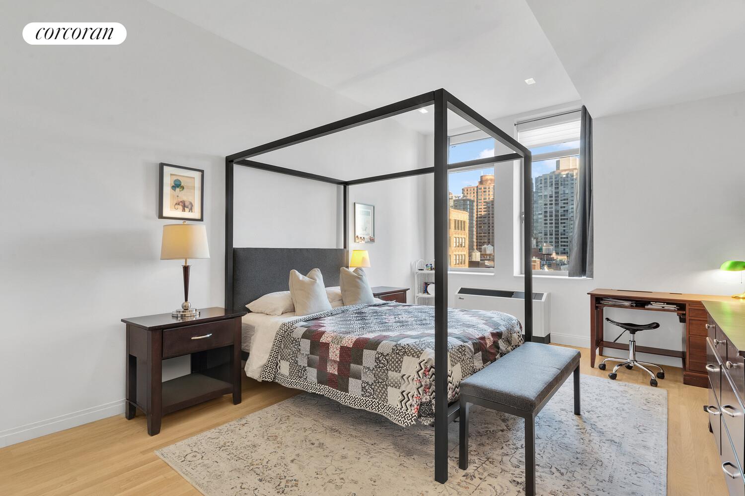 252 7th Avenue, Unit 16J Manhattan, NY 10001 - Photo 4 of 8 a bedroom with bed and a window
