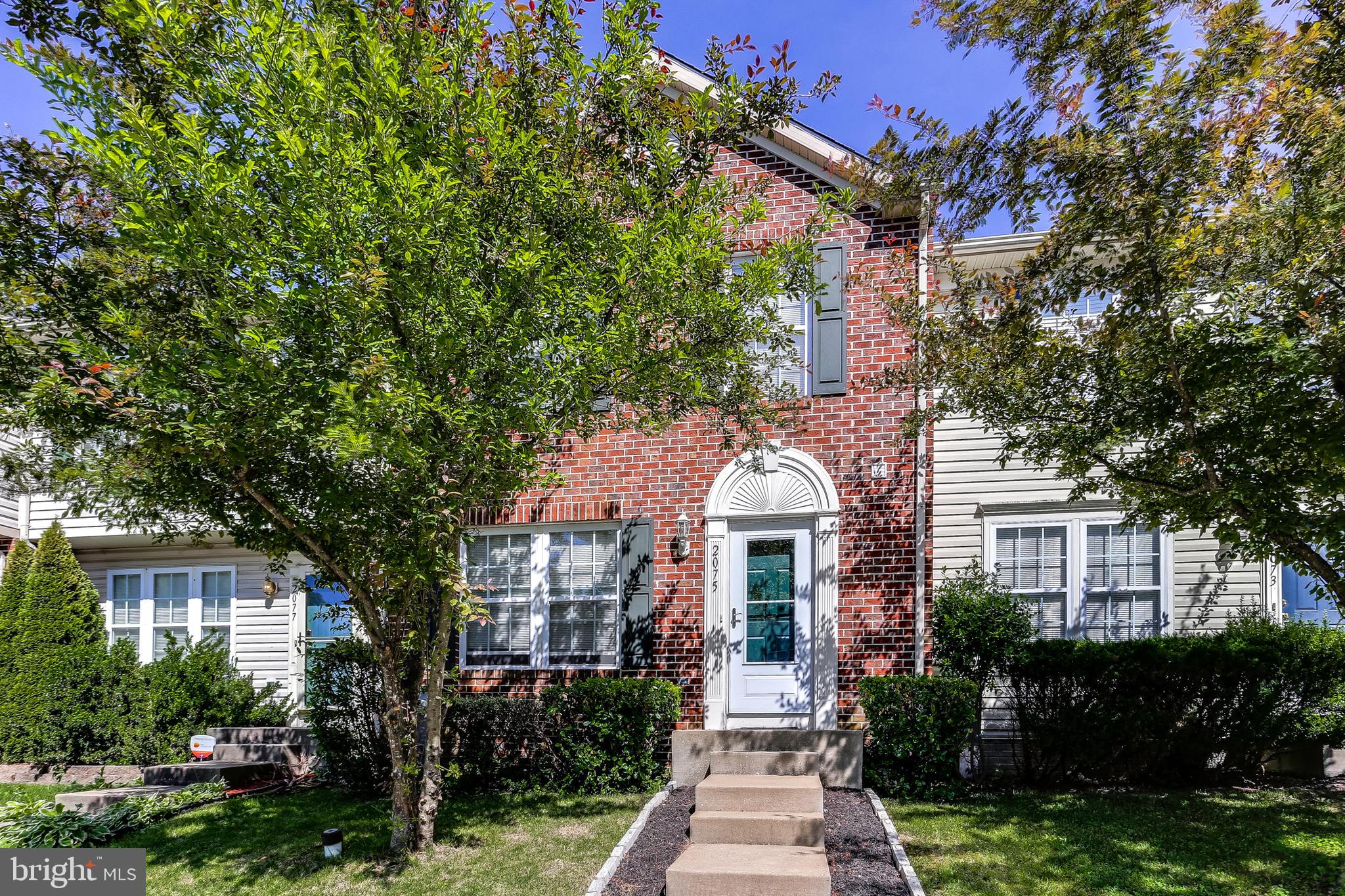 2075 Paperbark Road Baltimore, MD 21221 - Photo 2 of 22 a front view of a house with yard