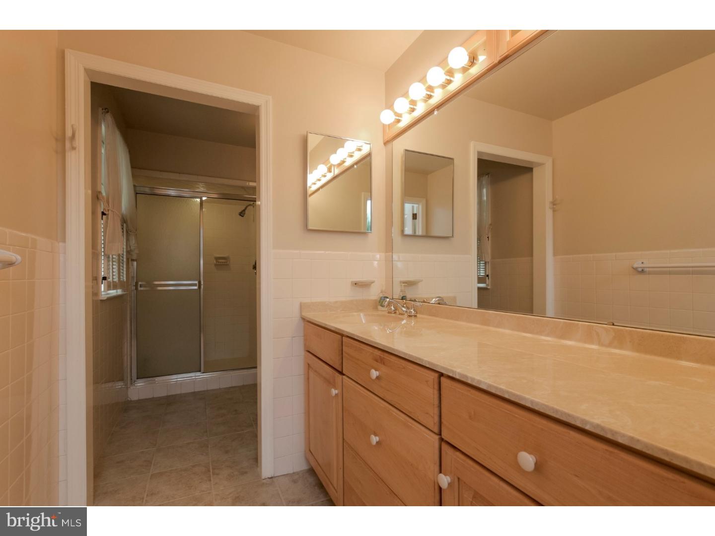 102 South Spring Valley Road Wilmington, DE 19807 - Photo 13 of 25 a bathroom with a granite countertop sink mirror and double