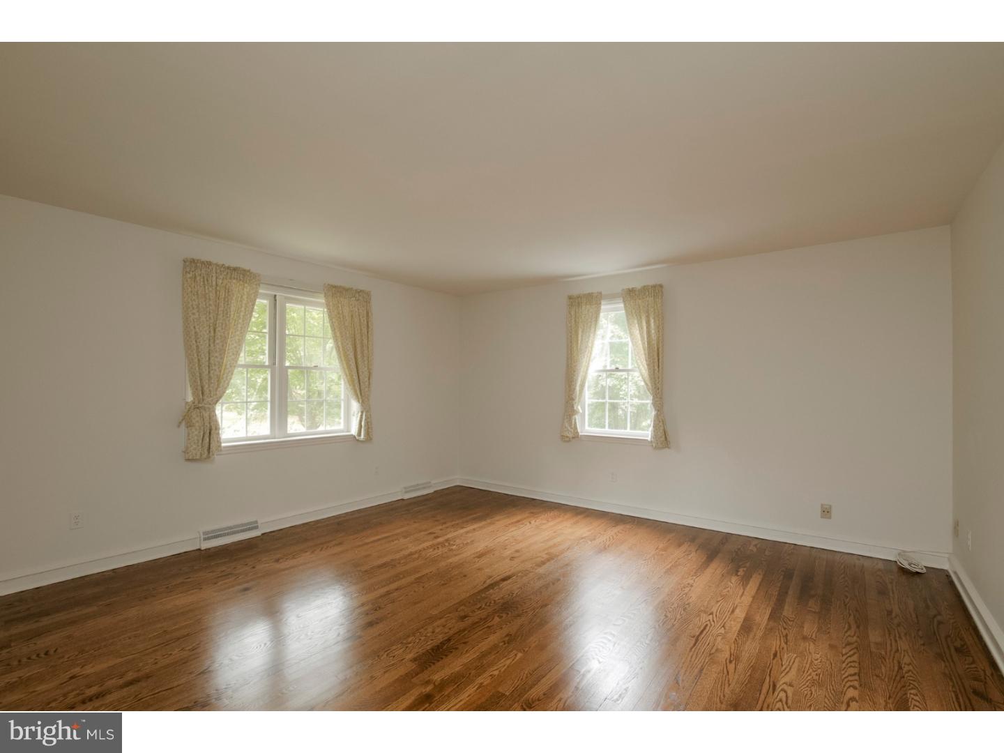 102 South Spring Valley Road Wilmington, DE 19807 - Photo 15 of 25 a view of an empty room with wooden floor and a window
