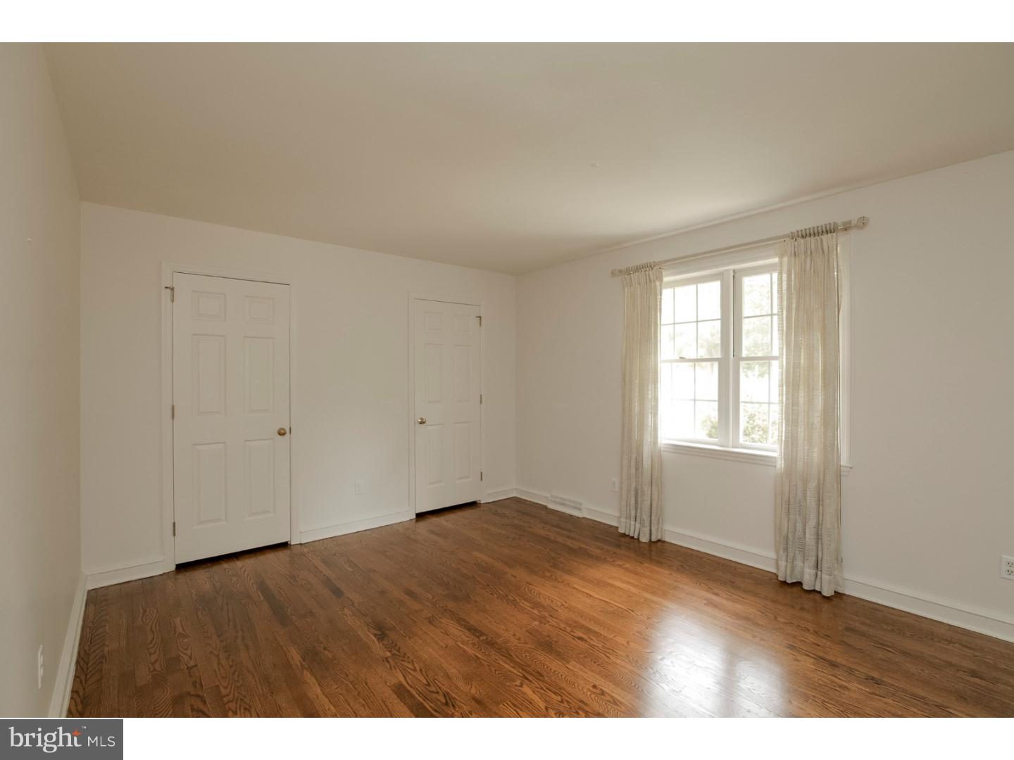102 South Spring Valley Road Wilmington, DE 19807 - Photo 16 of 25 a view of an empty room with wooden floor and a window