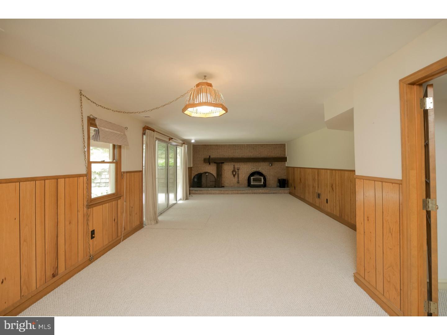 102 South Spring Valley Road Wilmington, DE 19807 - Photo 19 of 25 a view of empty room with a fireplace and window
