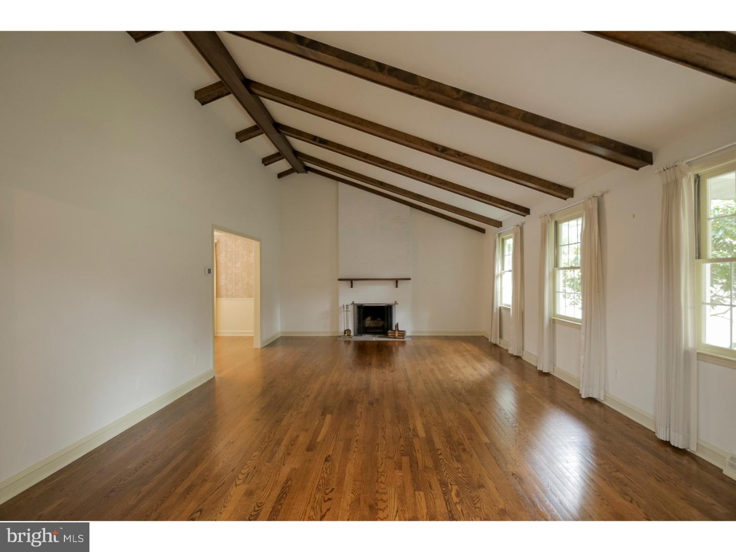 102 South Spring Valley Road Wilmington, DE 19807 - Photo 5 of 25 a view of empty room with wooden floor and fan