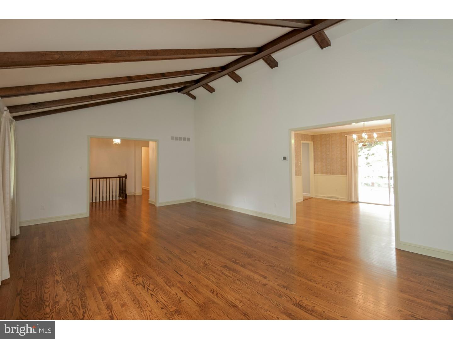 102 South Spring Valley Road Wilmington, DE 19807 - Photo 6 of 25 a view of an empty room with wooden floor and a window
