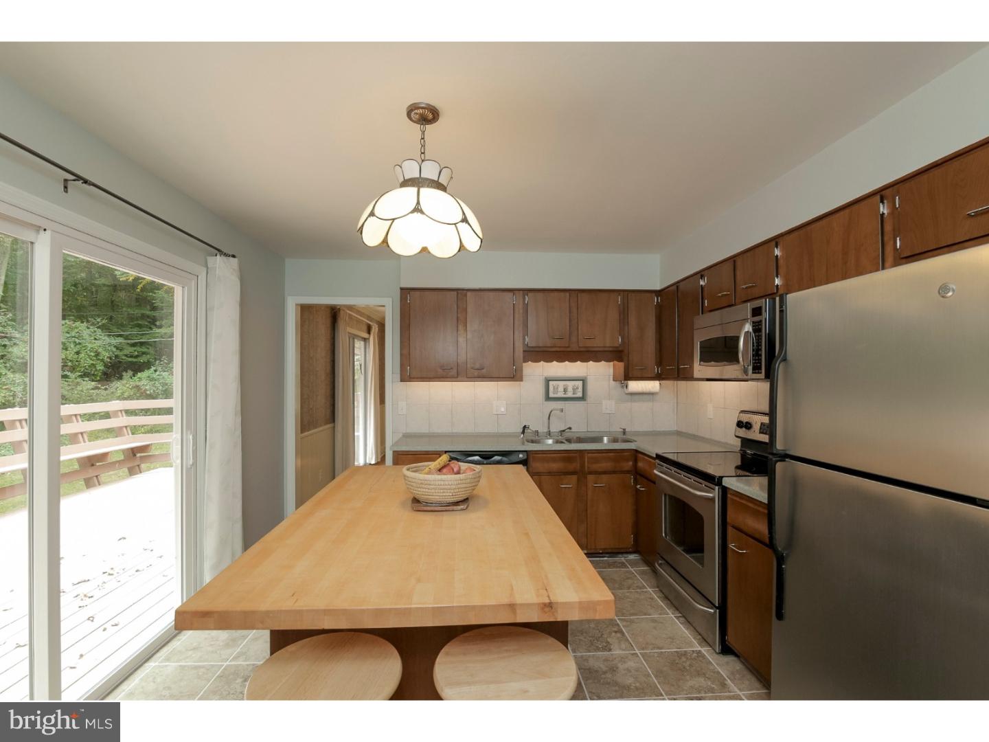 102 South Spring Valley Road Wilmington, DE 19807 - Photo 8 of 25 a kitchen with stainless steel appliances granite countertop a sink refrigerator and cabinets