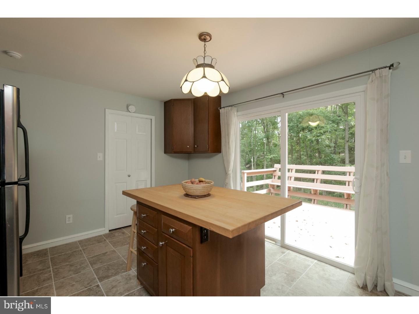 102 South Spring Valley Road Wilmington, DE 19807 - Photo 10 of 25 a kitchen with a sink a large window and a refrigerator