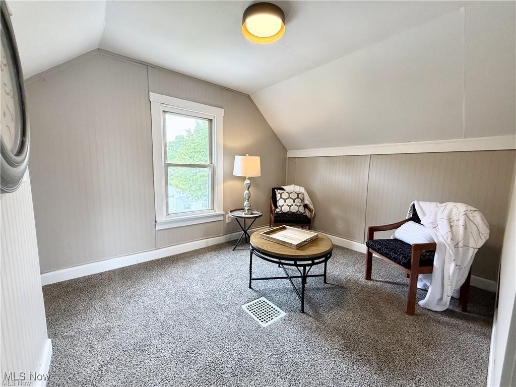 281 Sexton Street Struthers, OH 44471 - Photo 23 of 28 Living area featuring carpet flooring and lofted ceiling