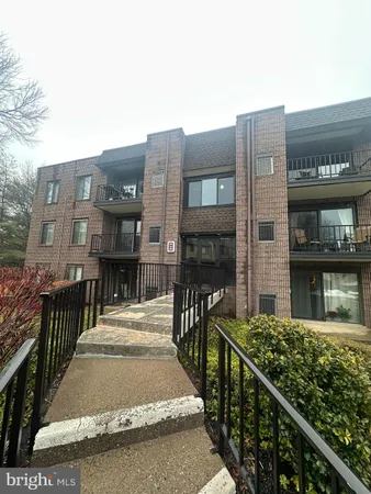 a view of a brick house with many windows