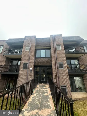 a view of a brick building with many windows