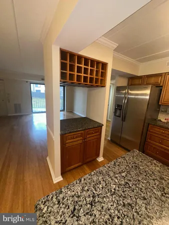 a view of kitchen with wooden floor