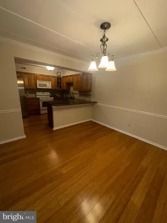 a kitchen with a sink and breakfast area