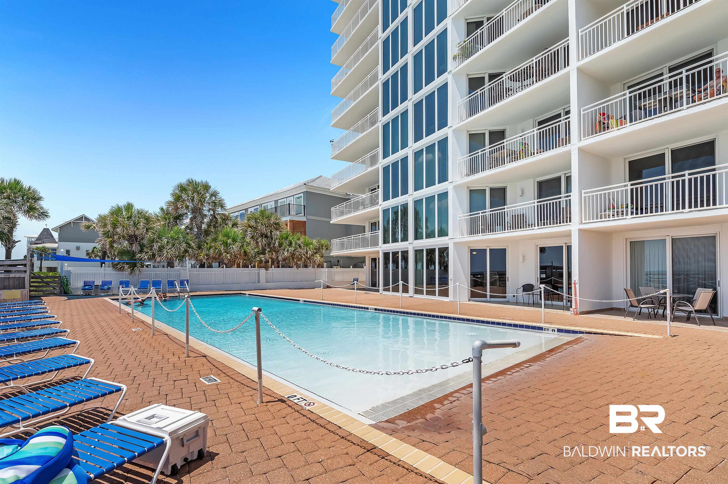 16287 Perdido Key Drive, Unit 105 Pensacola, FL 32507 - Photo 42 of 66 Rectangular swimming pool surrounded by a paver deck