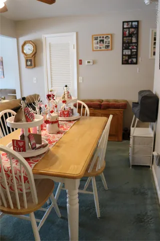 a living room with furniture a couch and dresser