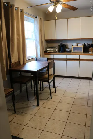 a kitchen with a stove a sink and a refrigerator