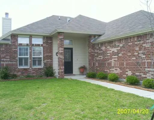 a view of a house with a garden