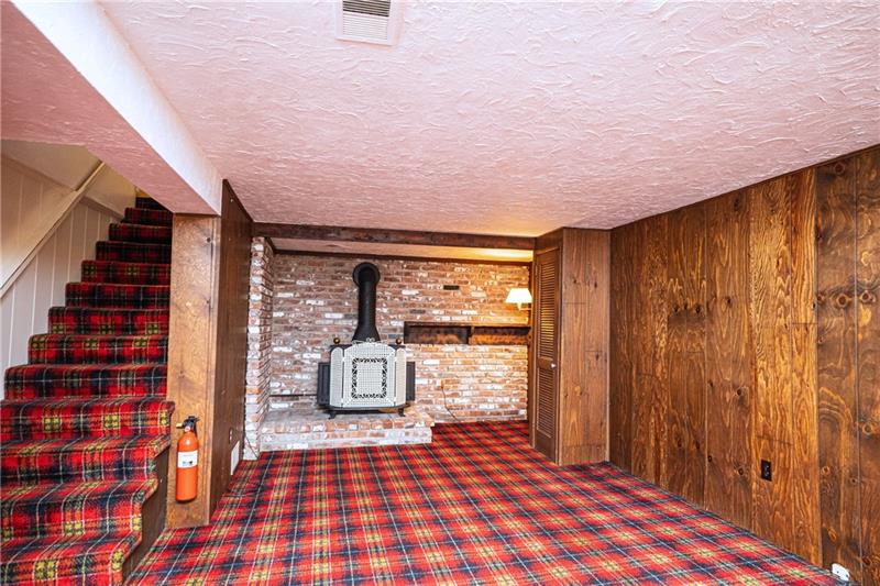 58 Bellview Circle McKees Rocks, PA 15136 - Photo 13 of 25 Large finished basement with gas fireplace.