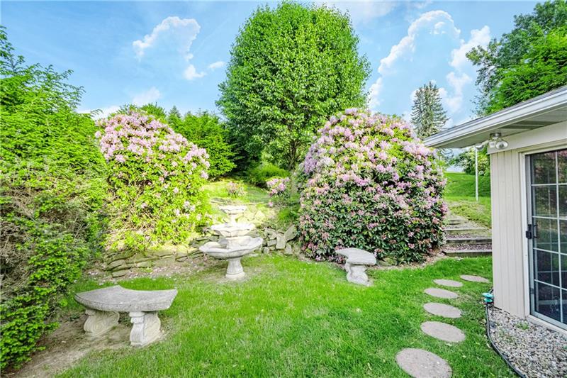 58 Bellview Circle McKees Rocks, PA 15136 - Photo 20 of 25 Mature landscaping to left of house.