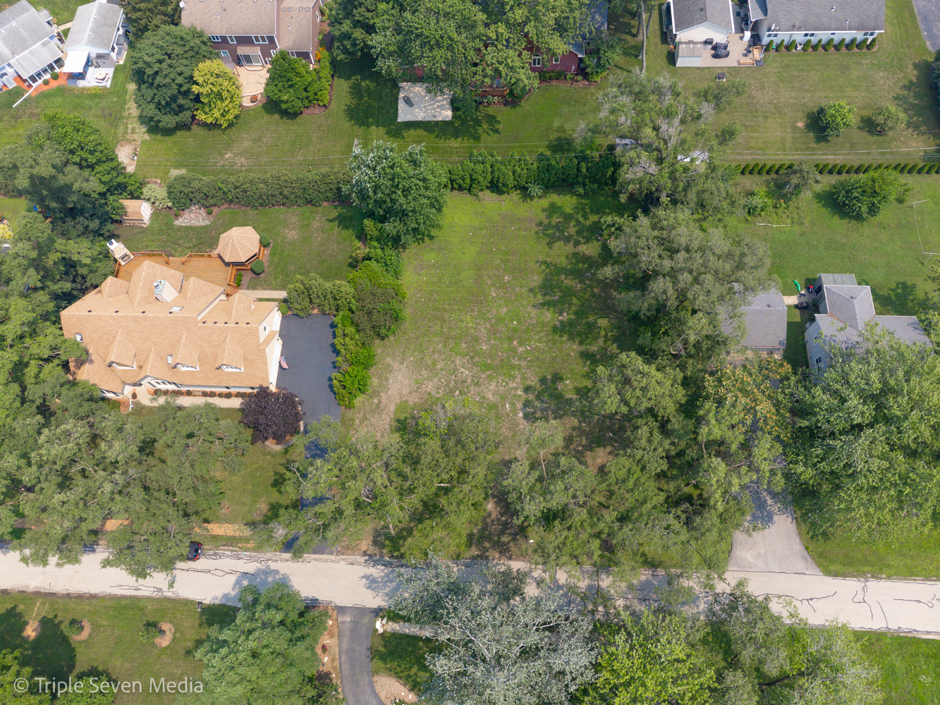 7213 Giddings Avenue Burr Ridge, IL 60527 - Photo 6 of 8 an aerial view of a house with a yard and lake view
