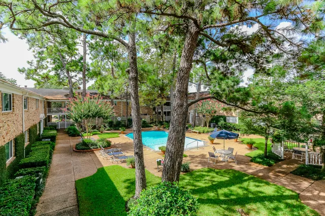 a view of balcony with wooden floor and fence