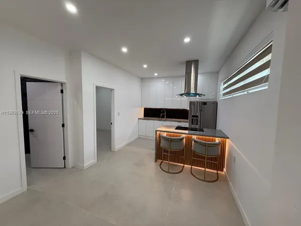 a view of kitchen with furniture and window