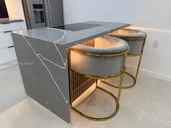 a kitchen with a stove and a refrigerator