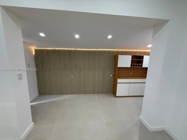 a view of room with window and ceiling fan