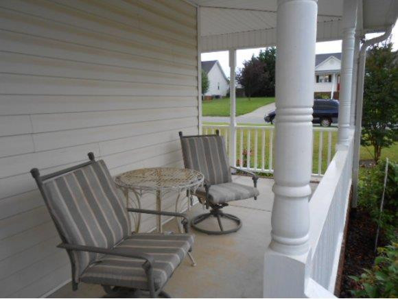 639 Wendy Graham, NC 27253 - Photo 17 of 21 a view of balcony with two chairs and a potted plant