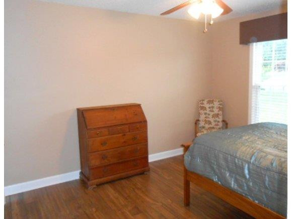 639 Wendy Graham, NC 27253 - Photo 9 of 21 a bedroom with a bed and a chair