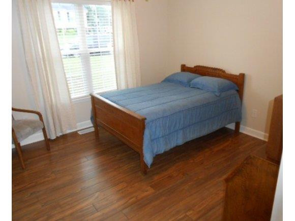 639 Wendy Graham, NC 27253 - Photo 10 of 21 a bed sitting in a bedroom next to a window