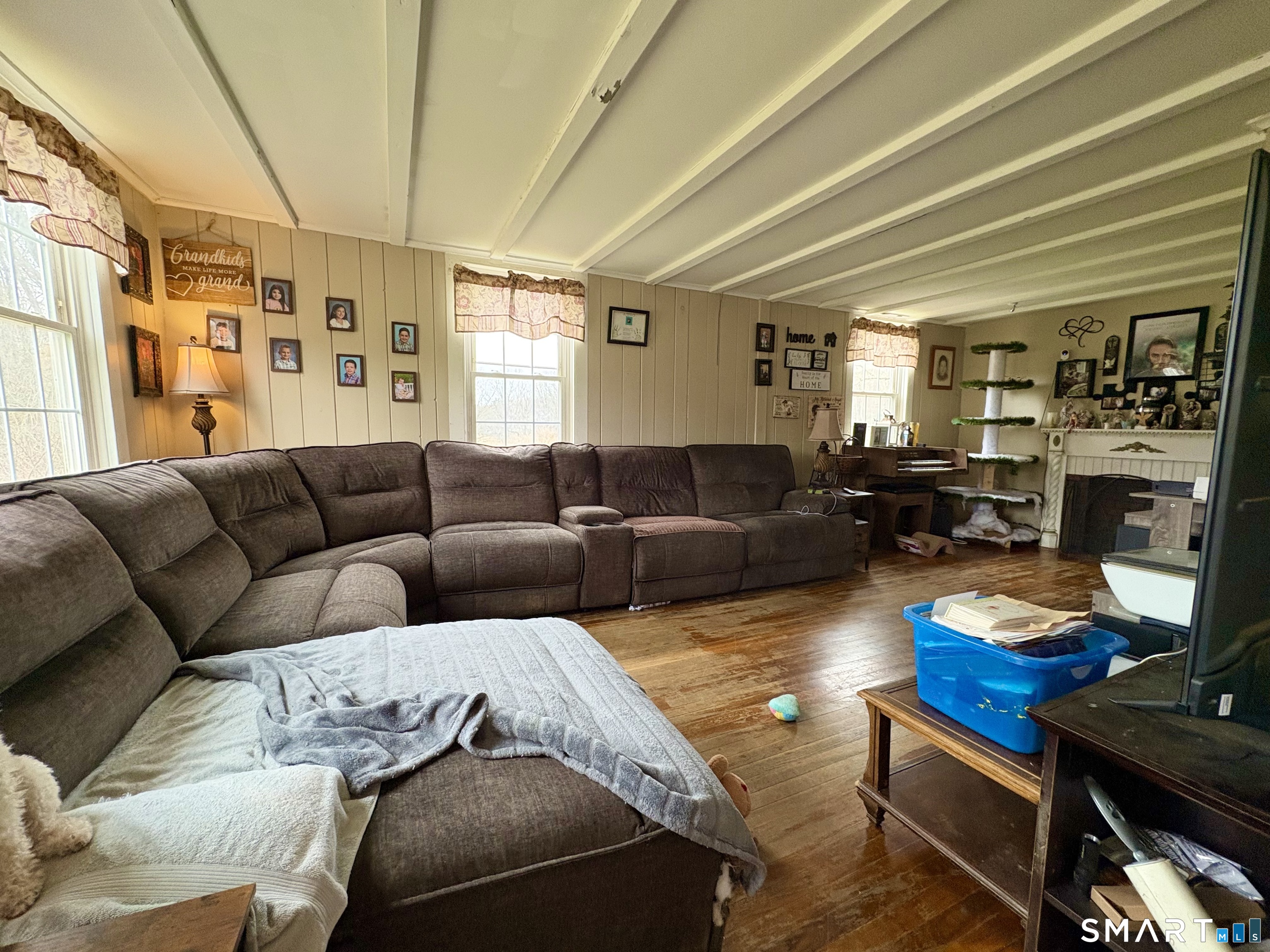 279 River Road Putnam, CT 06260 - Photo 13 of 18 a living room with furniture fireplace and a window