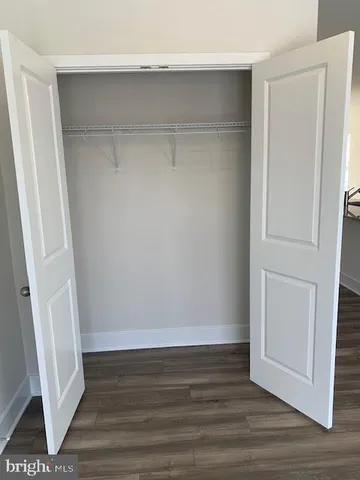 a view of an empty walk in closet