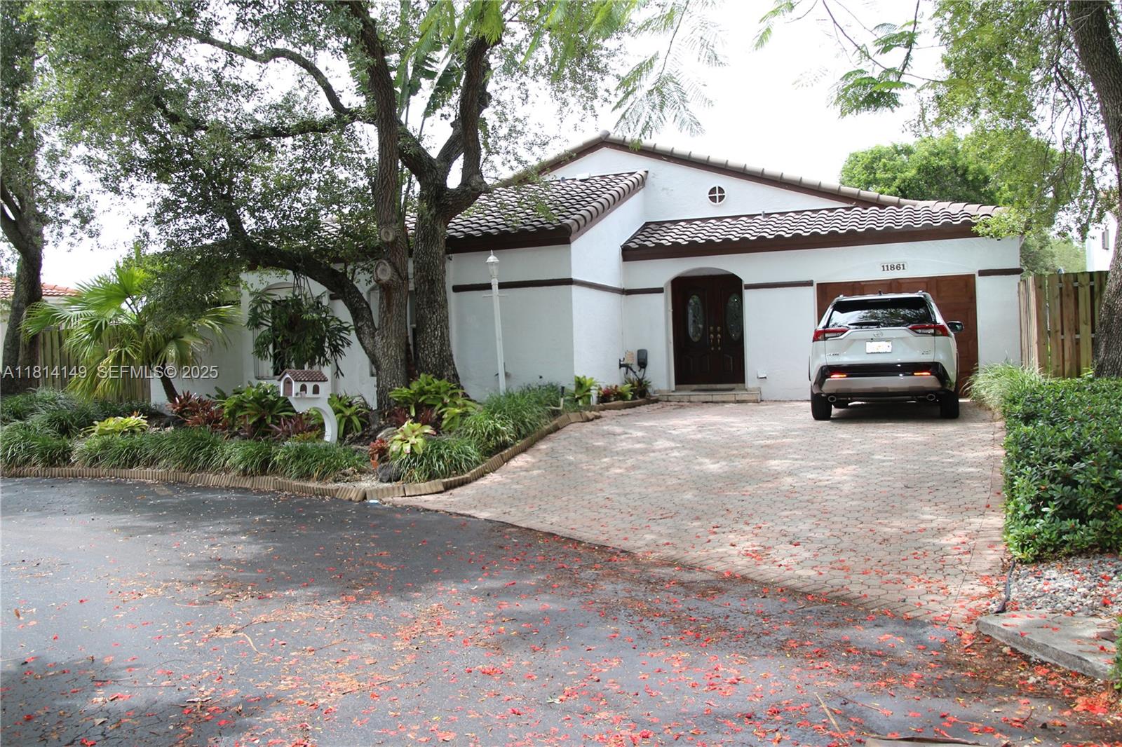 a front view of a house with garden