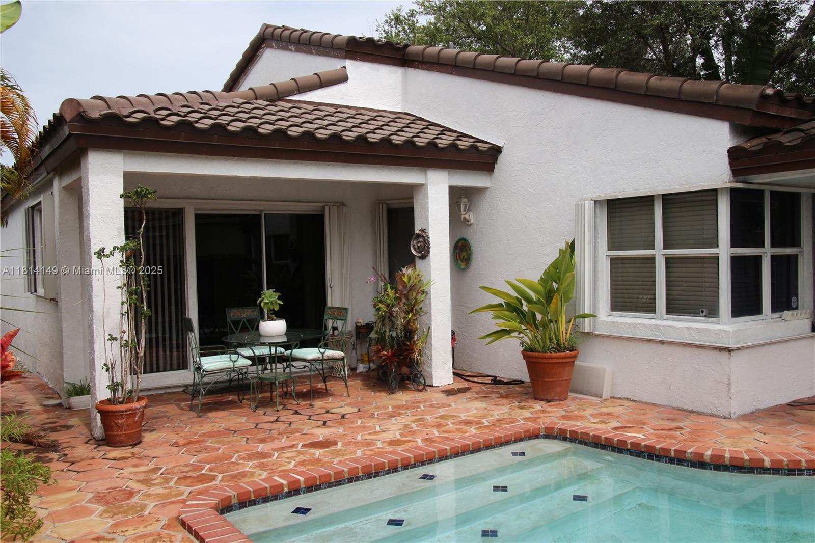11861 Southwest 92nd Lane Miami, FL 33186 - Photo 21 of 33 a view of a house with backyard porch and sitting area