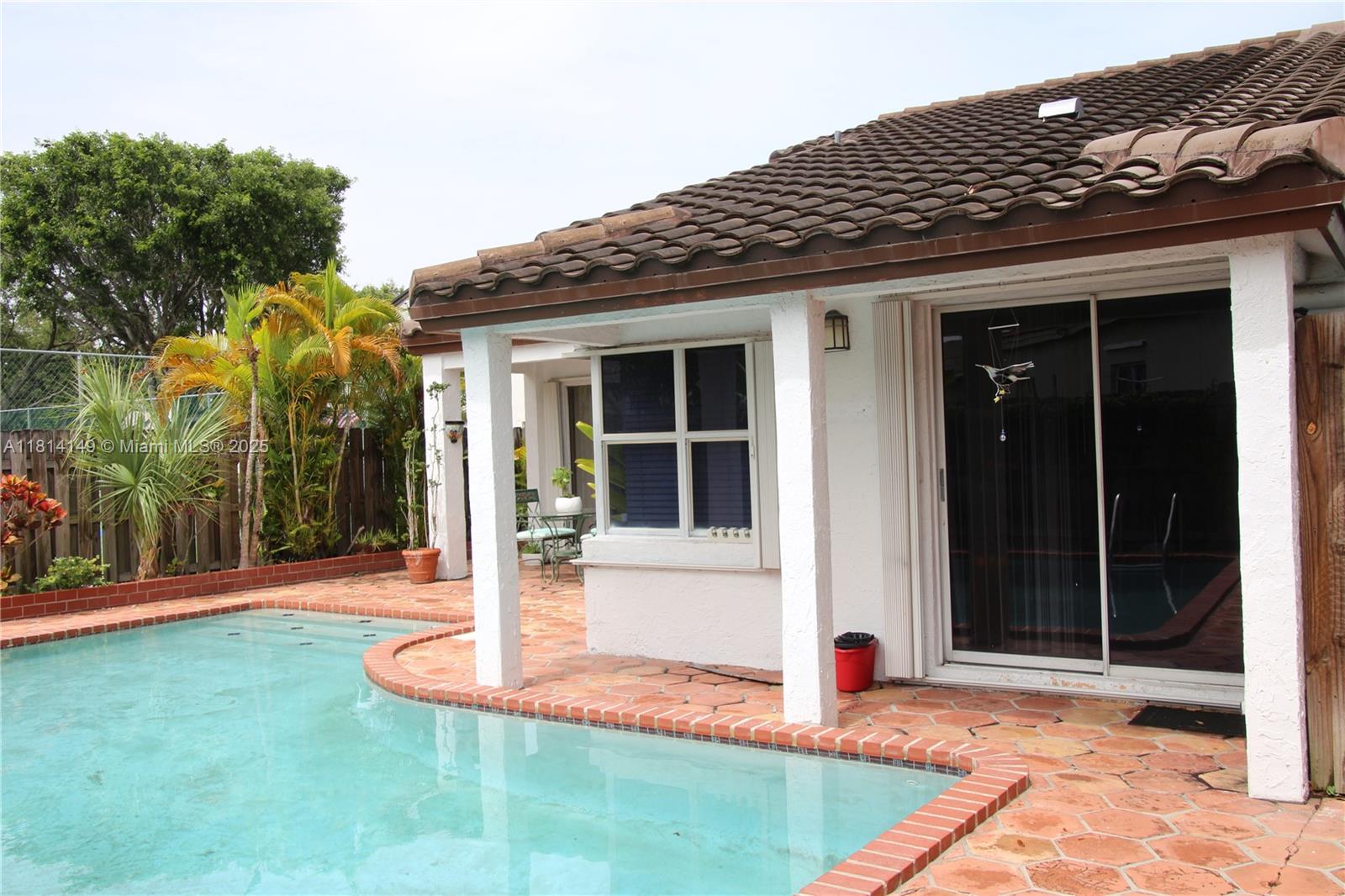 11861 Southwest 92nd Lane Miami, FL 33186 - Photo 22 of 33 a front view of a house with garden