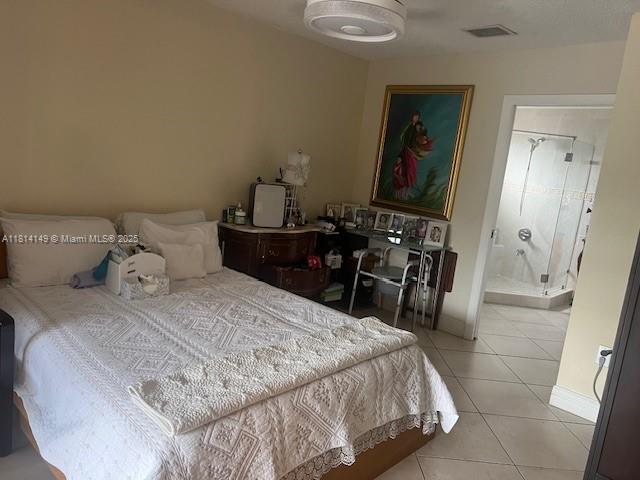 11861 Southwest 92nd Lane Miami, FL 33186 - Photo 25 of 33 a bedroom with a bed and a mirror