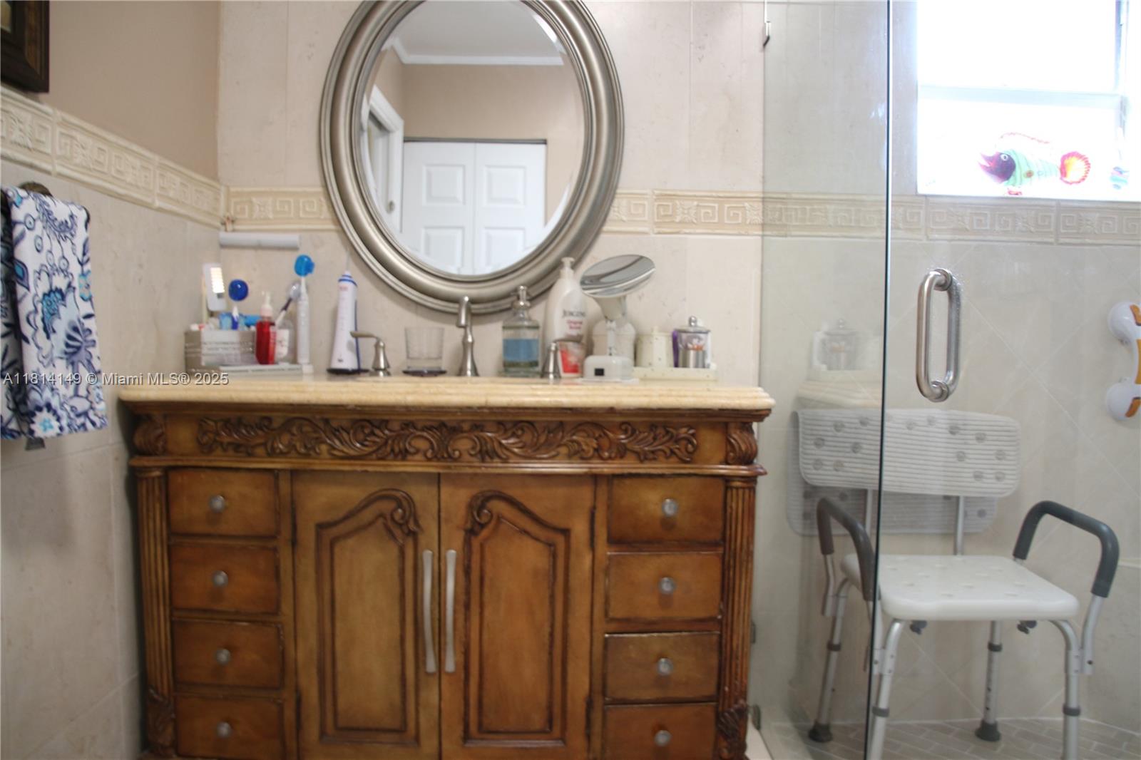 11861 Southwest 92nd Lane Miami, FL 33186 - Photo 26 of 33 a bathroom with a sink and a mirror