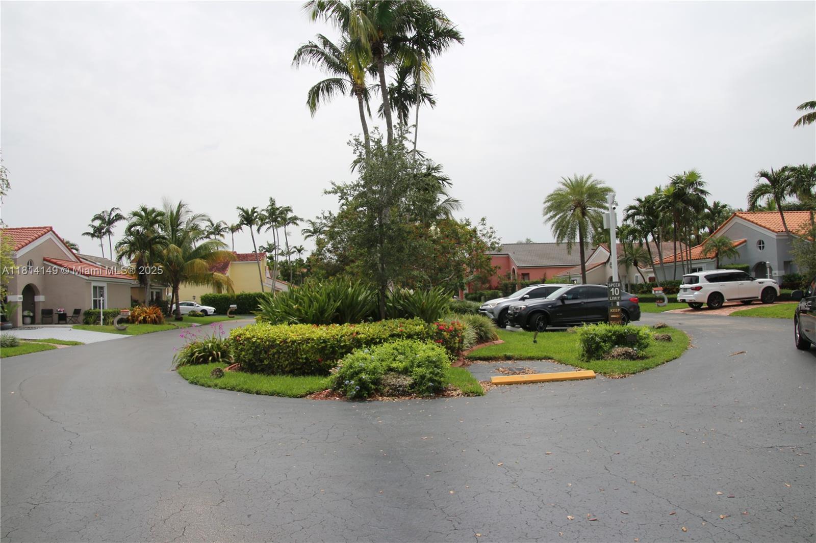 11861 Southwest 92nd Lane Miami, FL 33186 - Photo 33 of 33 a view of a street with a cars parked on the road