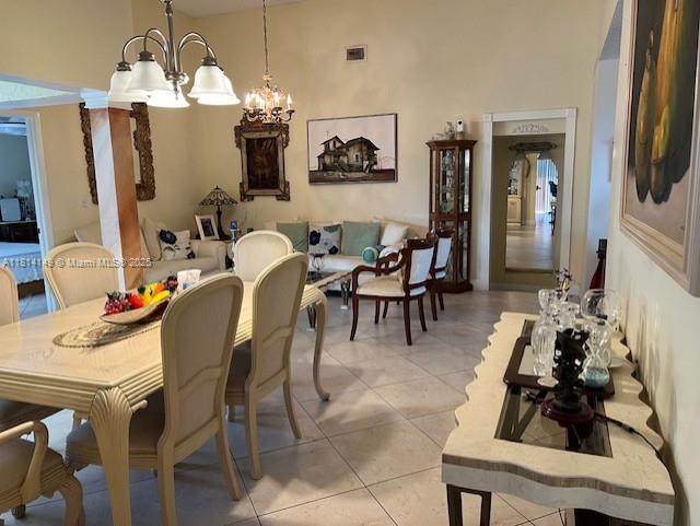 11861 Southwest 92nd Lane Miami, FL 33186 - Photo 9 of 33 a view of a dining room with furniture and chandelier