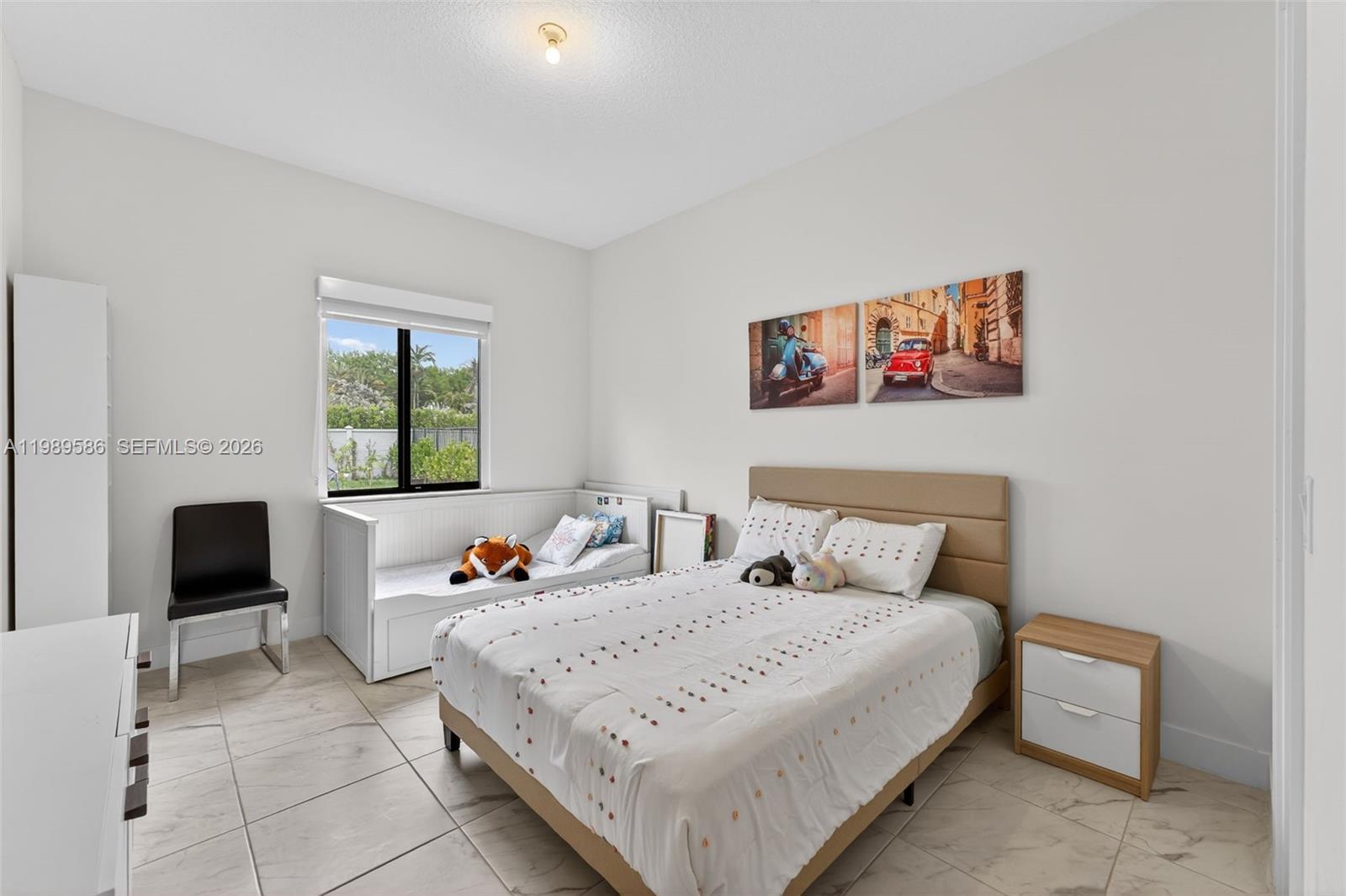 8267 Southwest 120th Terrace Miami, FL 33156 - Photo 13 of 61 a bedroom with a bed and a flat screen tv