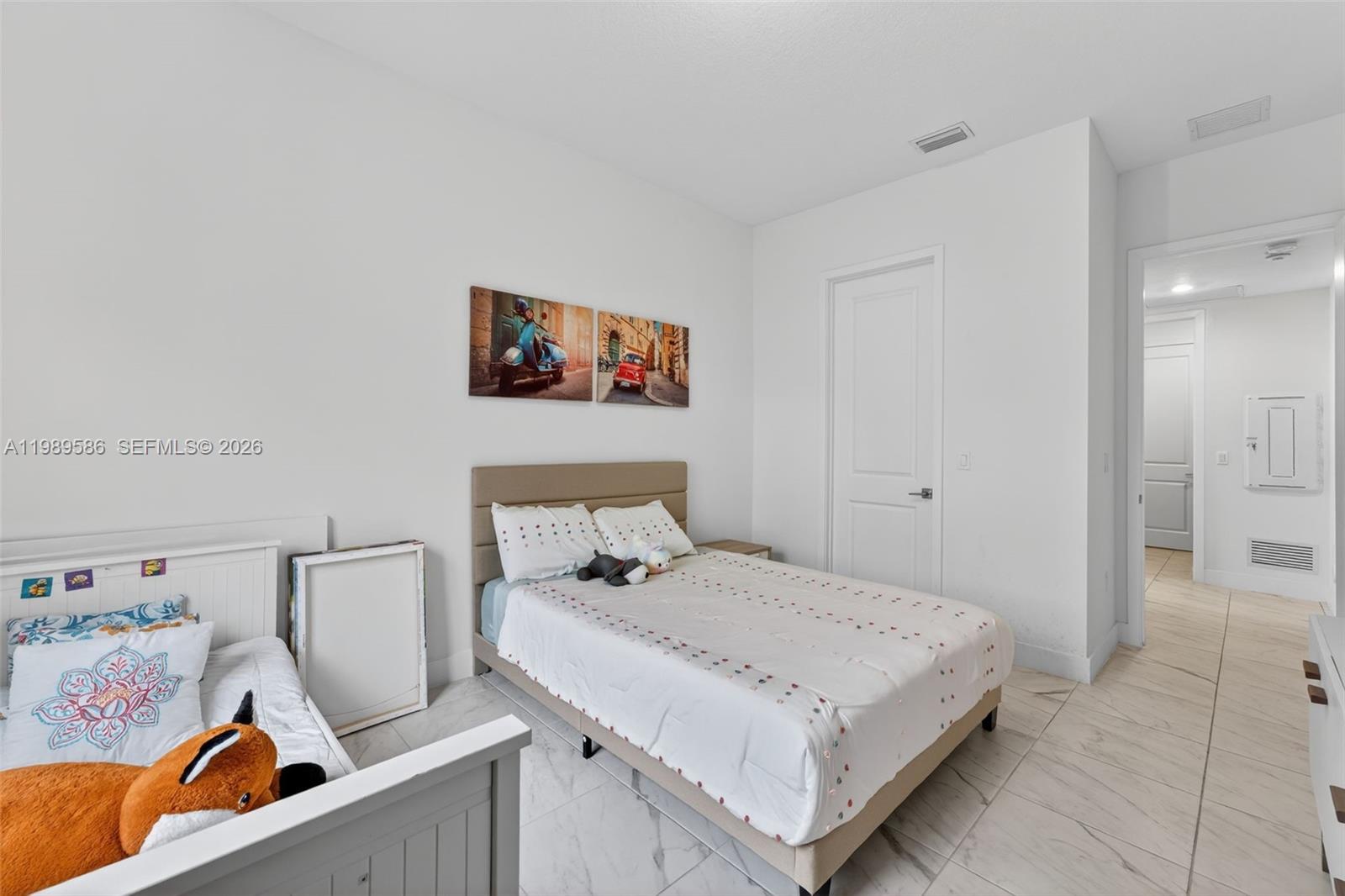 8267 Southwest 120th Terrace Miami, FL 33156 - Photo 14 of 61 a bedroom with a bed and a couch