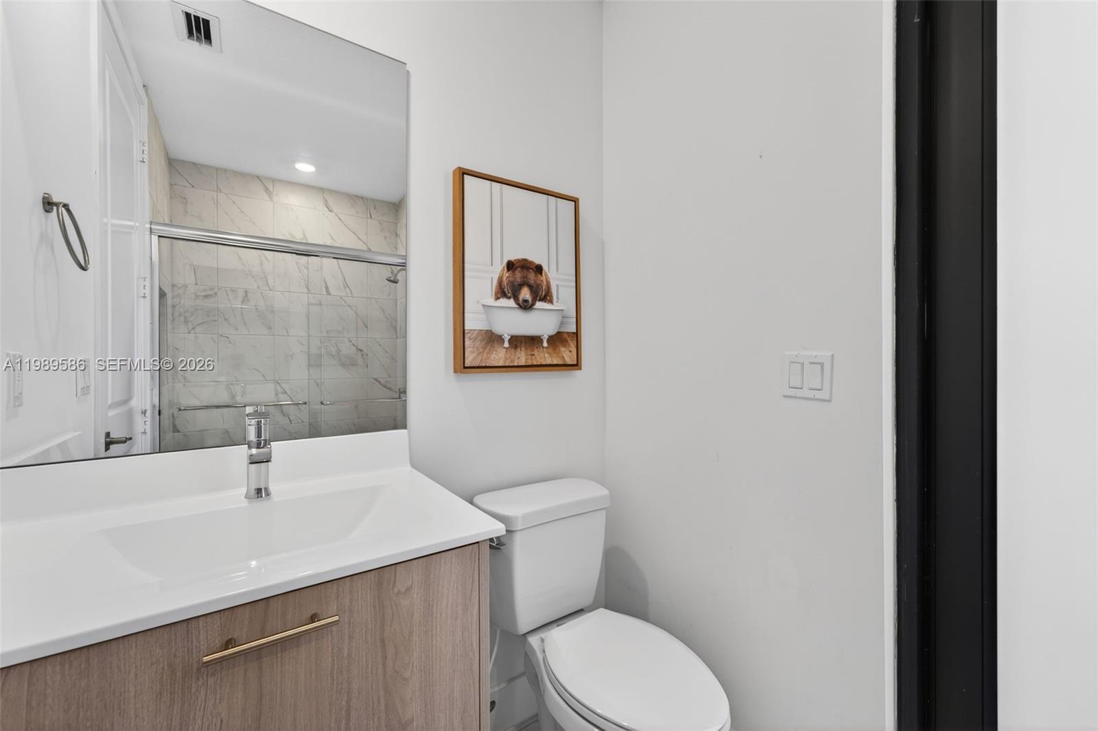 8267 Southwest 120th Terrace Miami, FL 33156 - Photo 15 of 61 a bathroom with a sink toilet and vanity