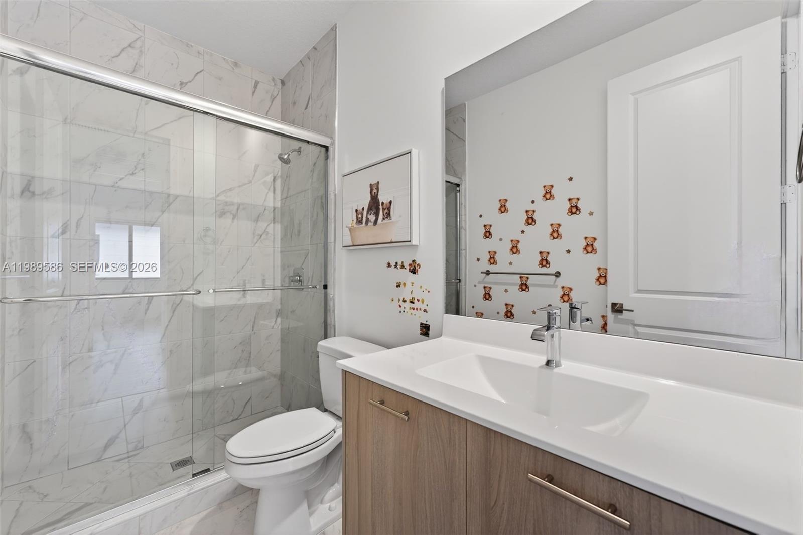8267 Southwest 120th Terrace Miami, FL 33156 - Photo 17 of 61 a bathroom with a sink toilet and shower