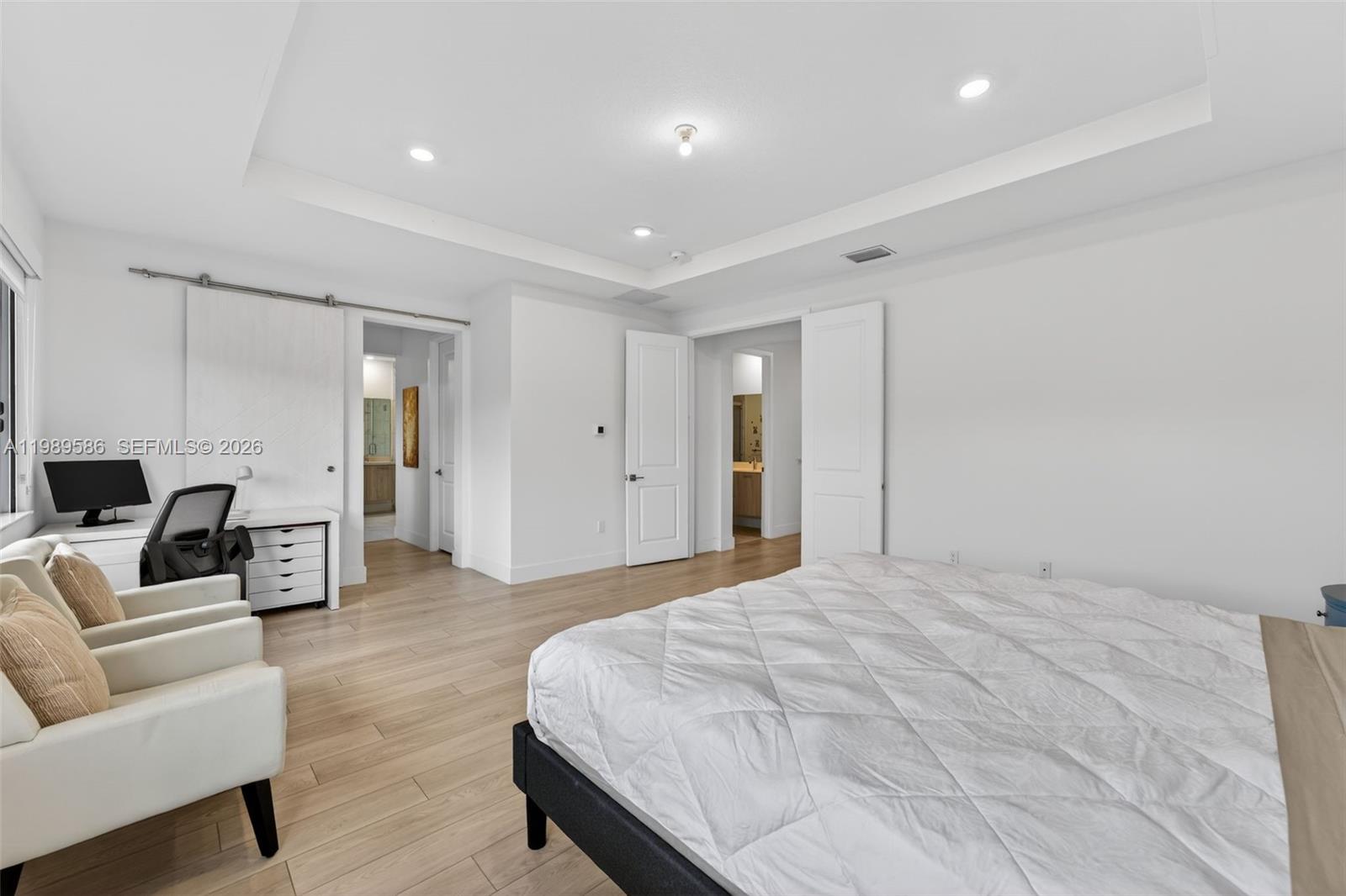 8267 Southwest 120th Terrace Miami, FL 33156 - Photo 21 of 61 a spacious bedroom with a bed and furniture